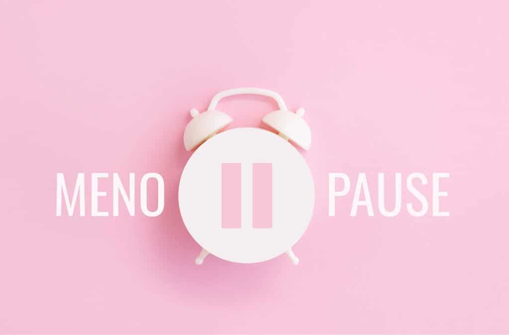 Menopause clock on a pink background
